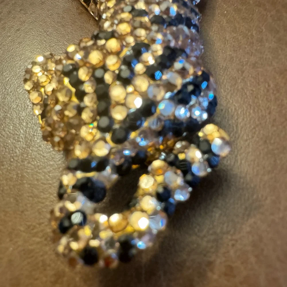 VTG gold tone articulated black & champagne rhinestone detailed tiger brooch